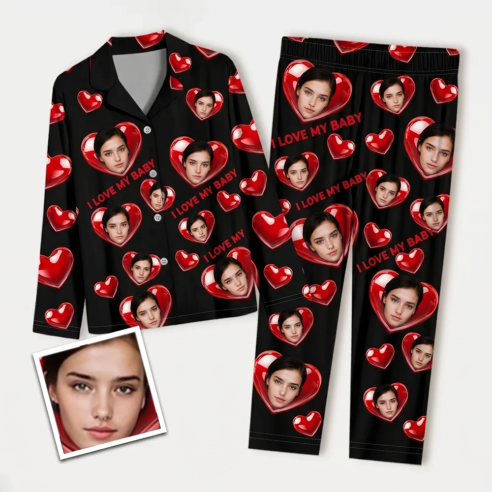 Flat lay of a custom long-sleeve pajama set with red hearts, displaying a sample uploaded face photo for personalization