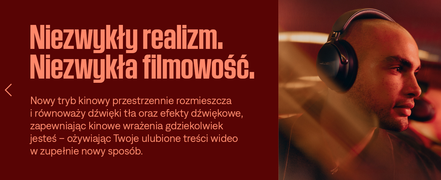Tekst brzmi: „Niesamowite realizm”. Baner lub obraz promocyjny z tekstem w ciemnoczerwonych odcieniach.