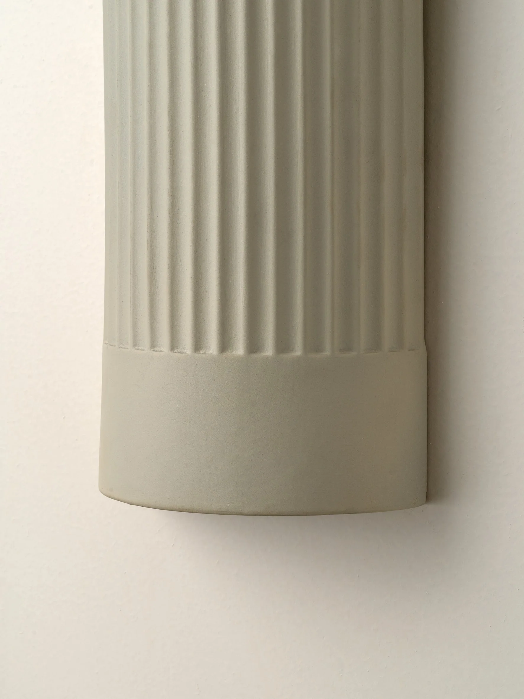 Enza - warm white  ribbed ceramic wall light