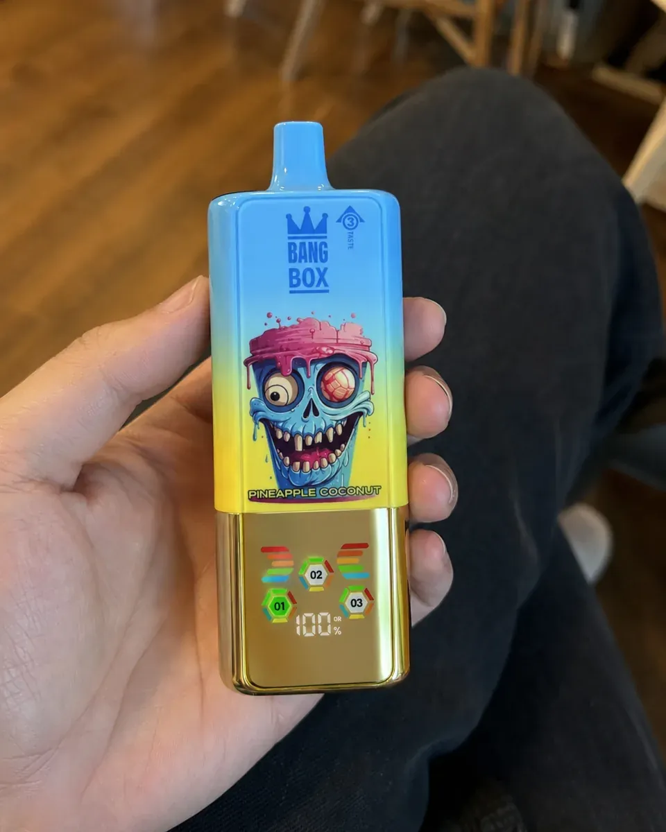 Klient VAPESEL PL – e-papieros z niebiesko-żółtym gradientem i motywem czaszki, wyświetlacz LCD