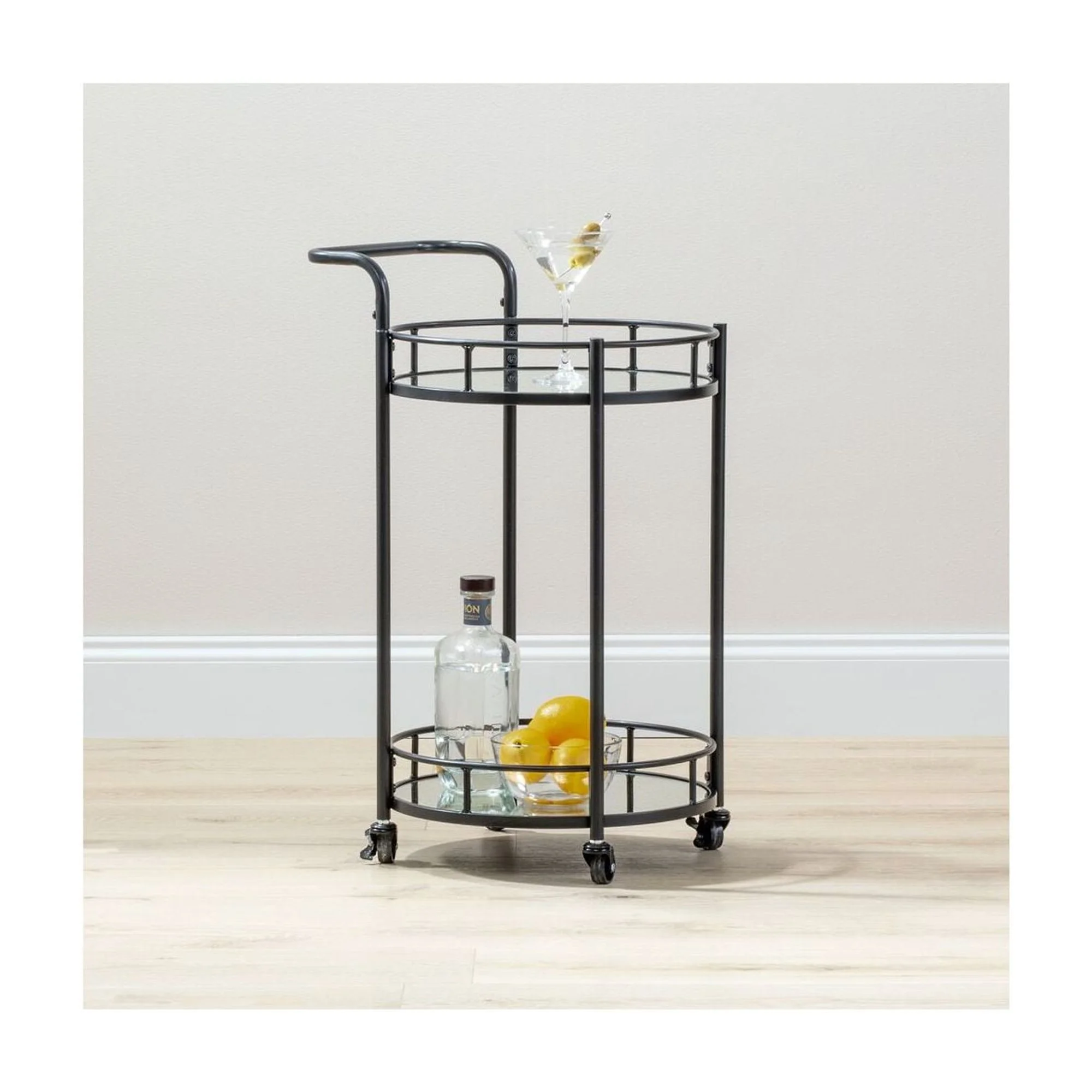 mDesign Metal Vintage Round Beverage Rolling Cart for Home - 2-Tier Serving Bar Trolley with Easy-Glide, Rotating Wheels, Built-in Handle, and Glass Shelves for Wine and Craft Beer - Black Round