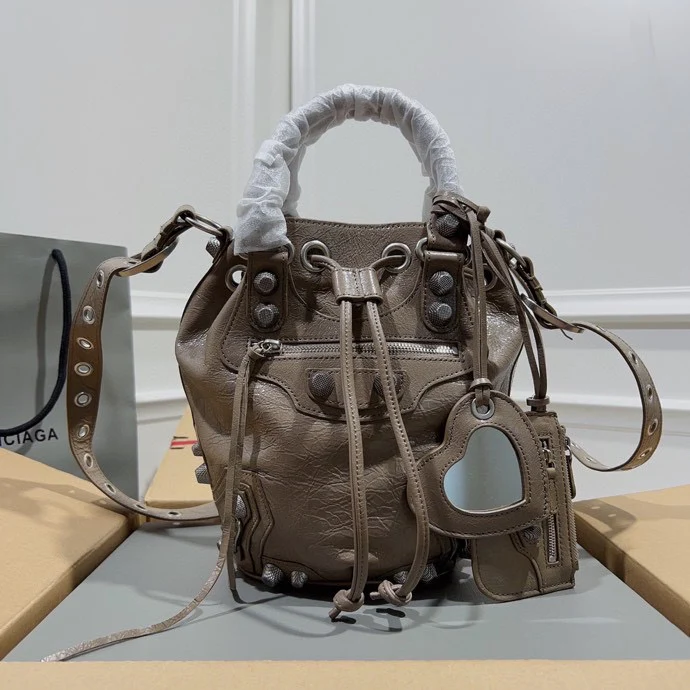Metallic Balenciaga Bucket Bag with Studs and Adjustable Straps for Edgy Fashion Style No.3033 - Replicaclubs