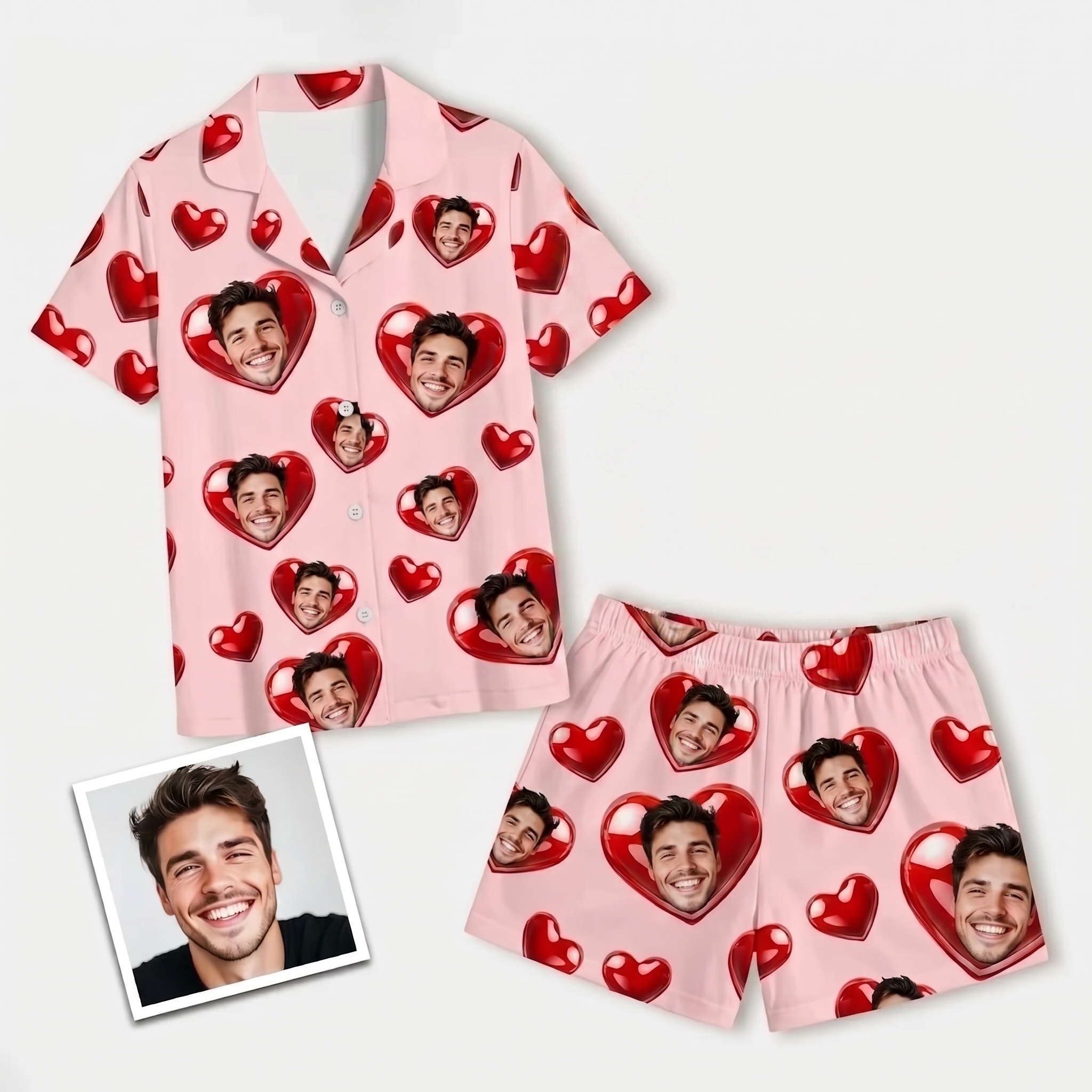 Flat lay of a personalized photo pajama set for women, featuring a pink short-sleeve shirt and shorts with custom faces and red hearts