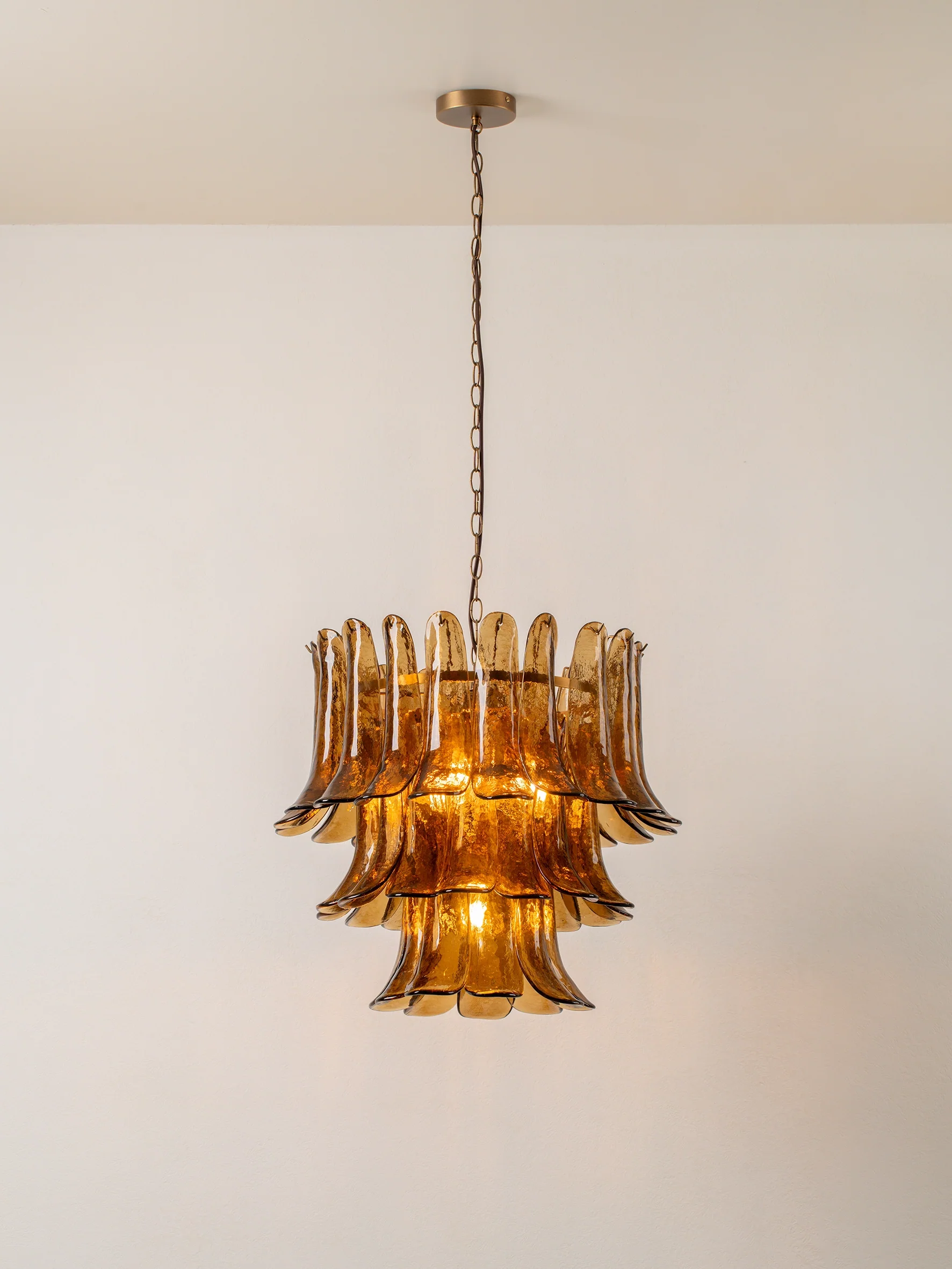 Lonso - 4 light aged brass and smoked brown glass chandelier